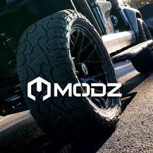 MODZ 14-inch wheel with steel belted radial street tire on a Venom EV cart